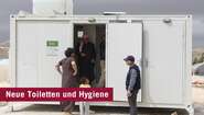 2019-img_3476-retusche-fluechtlinge-toiletten-syrien-whh-jesscica-kuehnle.jpg Flüchtlinge stehen vor neuem Toilettenhaus, Syrien.
